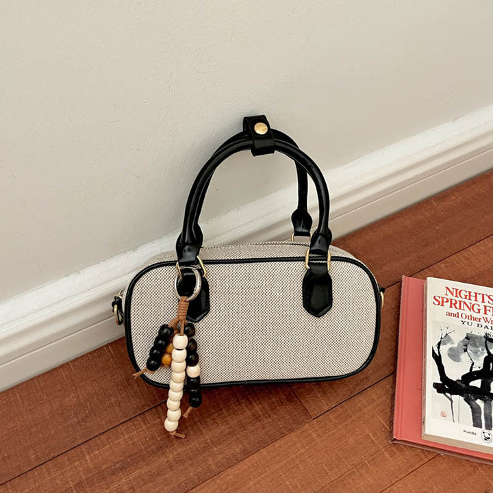 Vintage-Inspired Glossy Handheld Satchel