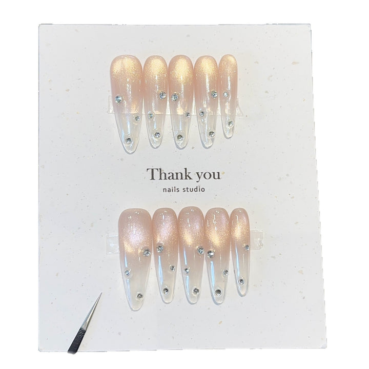 Artificial nails with shimmering accents and elegant rhinestone details Stornfield