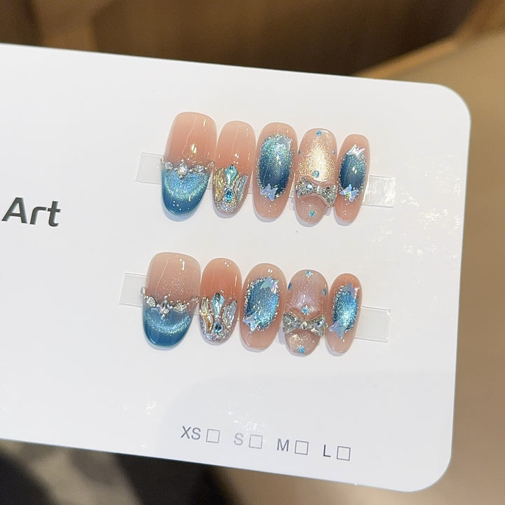 Artificial nail tips with glitter and watercolor effect Stornfield