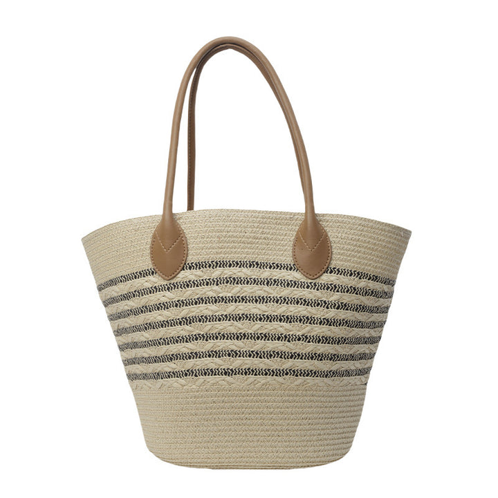 Beach bag made of natural woven material with elegant accents Stornfield