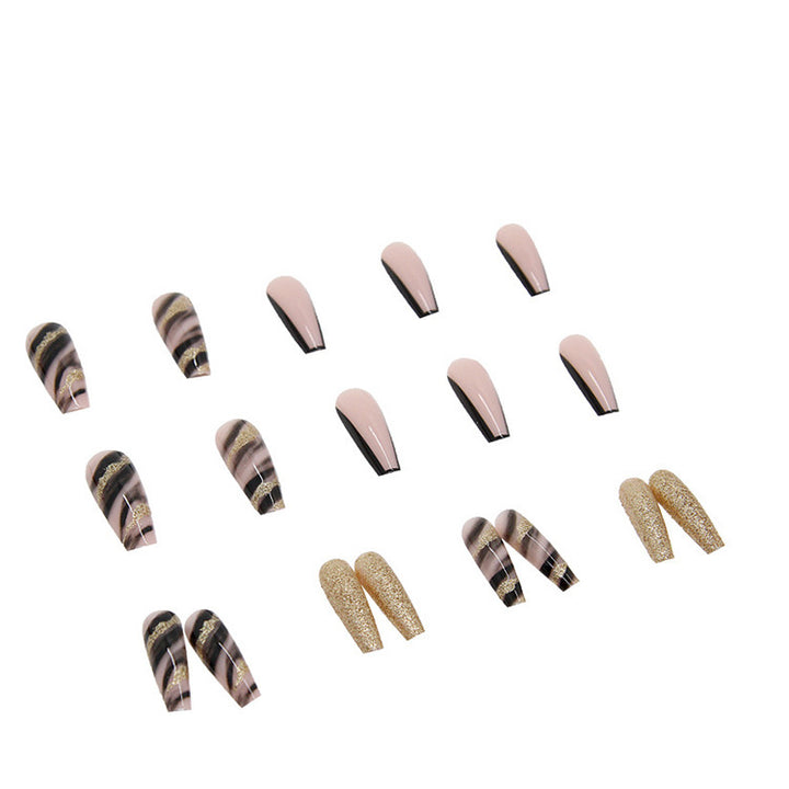 Acrylic nail set with luxurious golden accents and elegant designs Stornfield