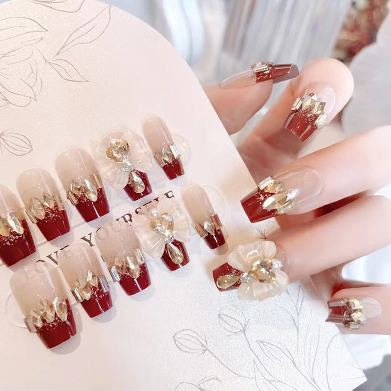 Artificial nails with glamorous floral decorations Stornfield