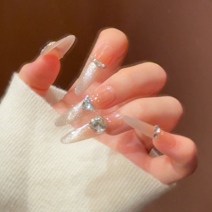Artistic Stiletto Press-On Nail Art with Glimmering Accents Stornfield