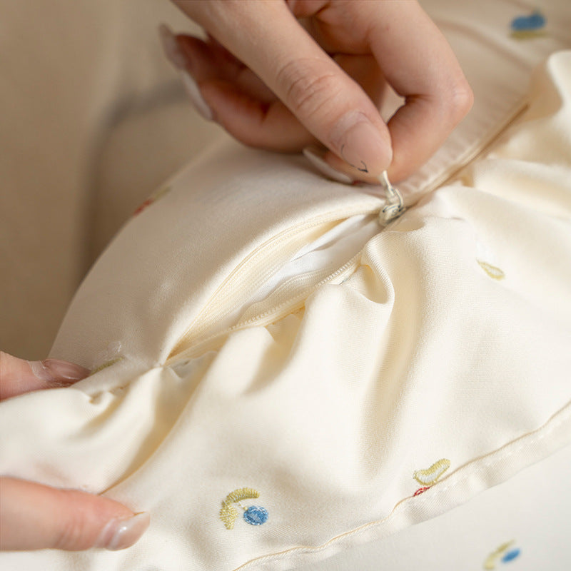 Square embroidered cushion cover made of cotton blend with frill edge Stornfield