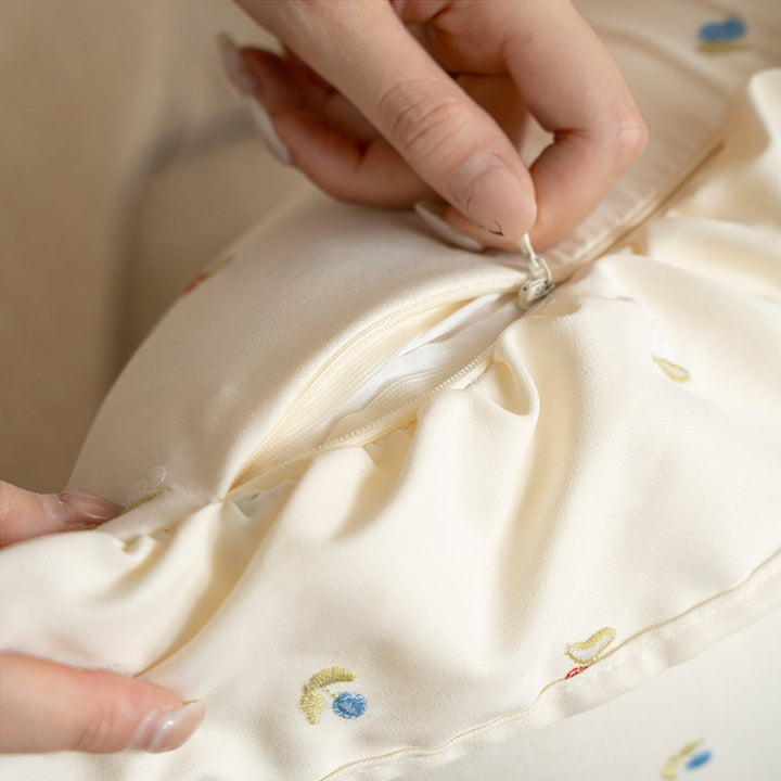 Square embroidered cushion cover made of cotton blend with frill edge Stornfield