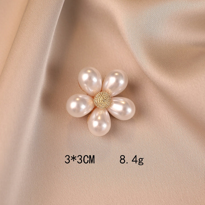 Elegant flower brooch with pearl accents Stornfield