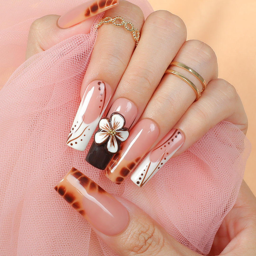 Creative nail art set with delicate floral and glitter accents Stornfield