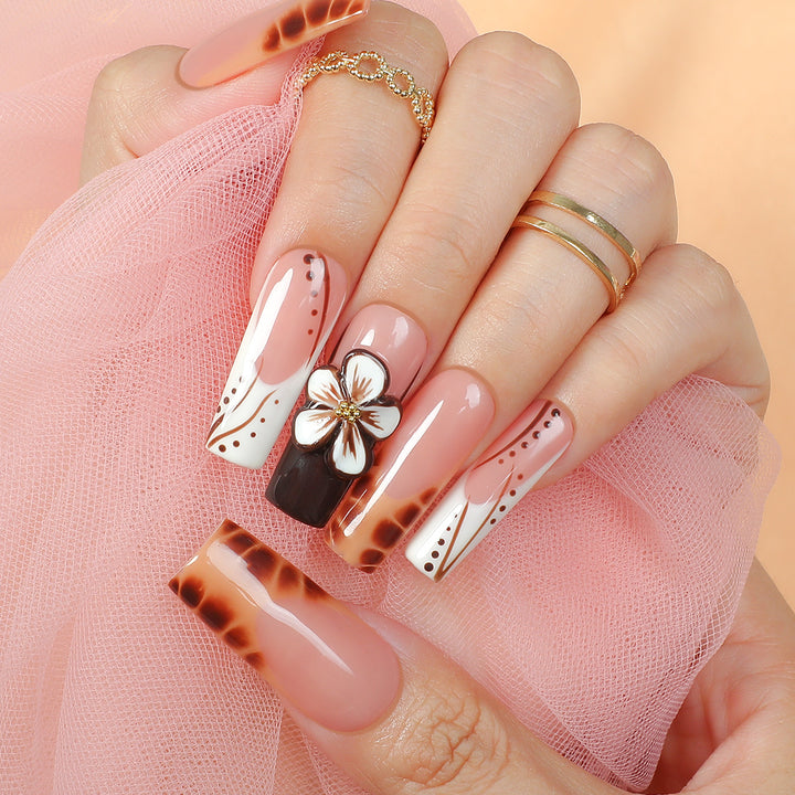 Creative nail art set with delicate floral and glitter accents Stornfield