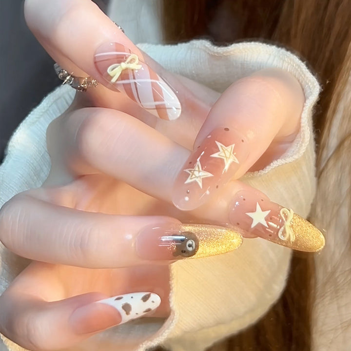 Glamorous artificial nails with creative embellishments Stornfield