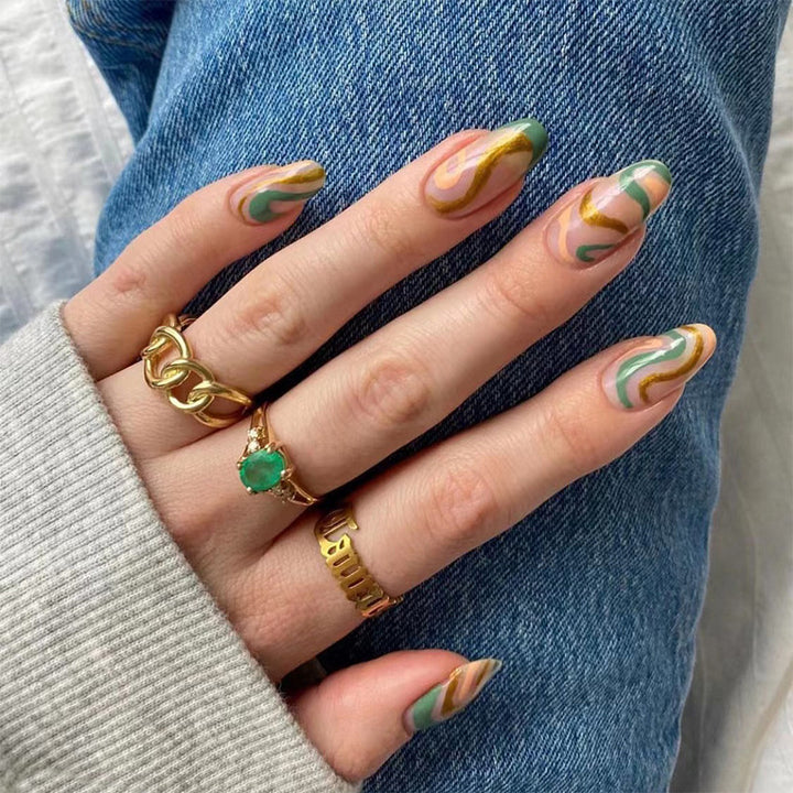 Artful nail extensions with an elegant leaf pattern Stornfield