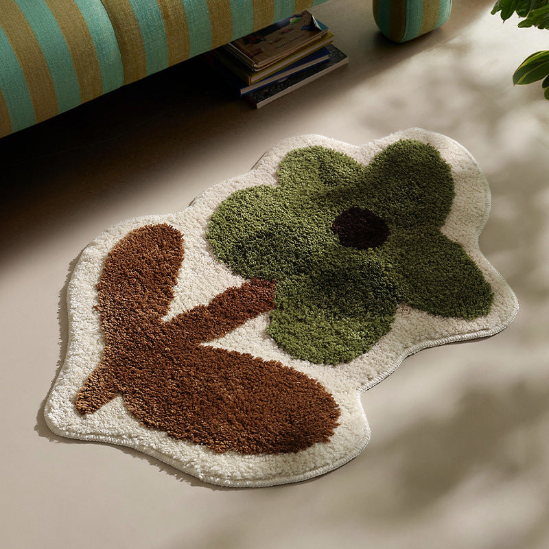 Flower-shaped hand-tufted bath mat with voluminous pile and non-slip latex backing Stornfield