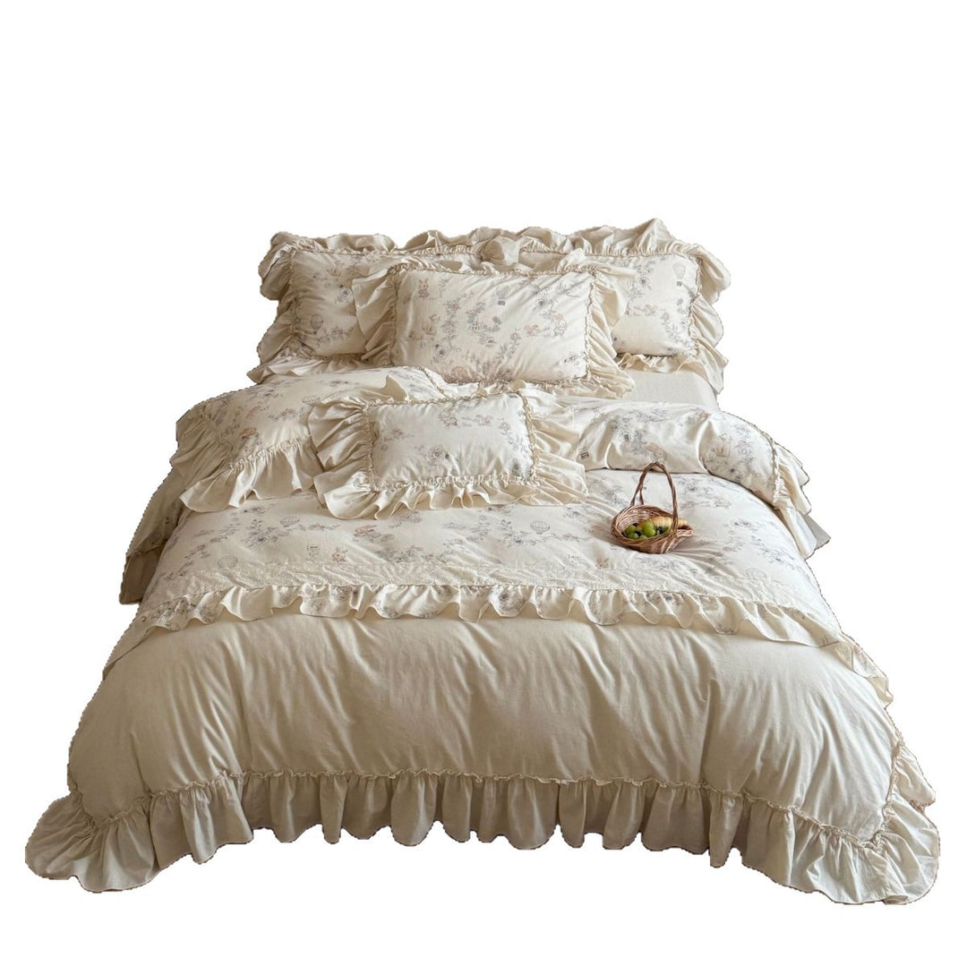 Romantic bedding set with ruffles, floral jacquard application and decorative cushions