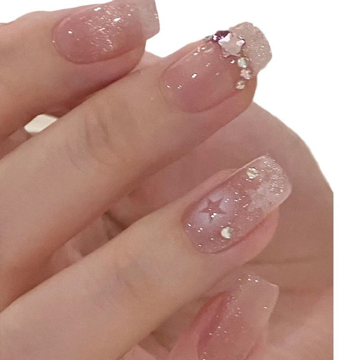 Glittering star motif artificial nails Stornfield