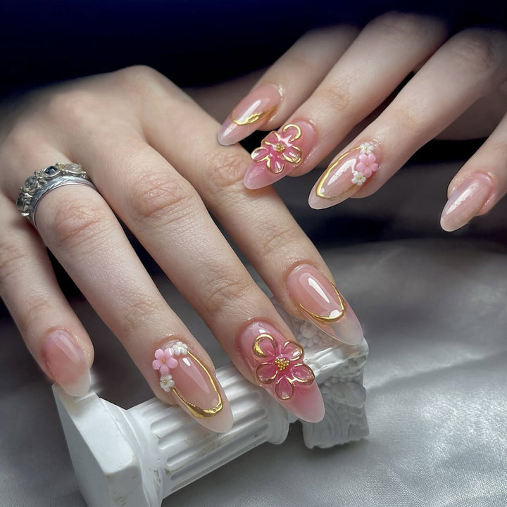 Acrylic nail set with elegant flower and gold decorations Stornfield