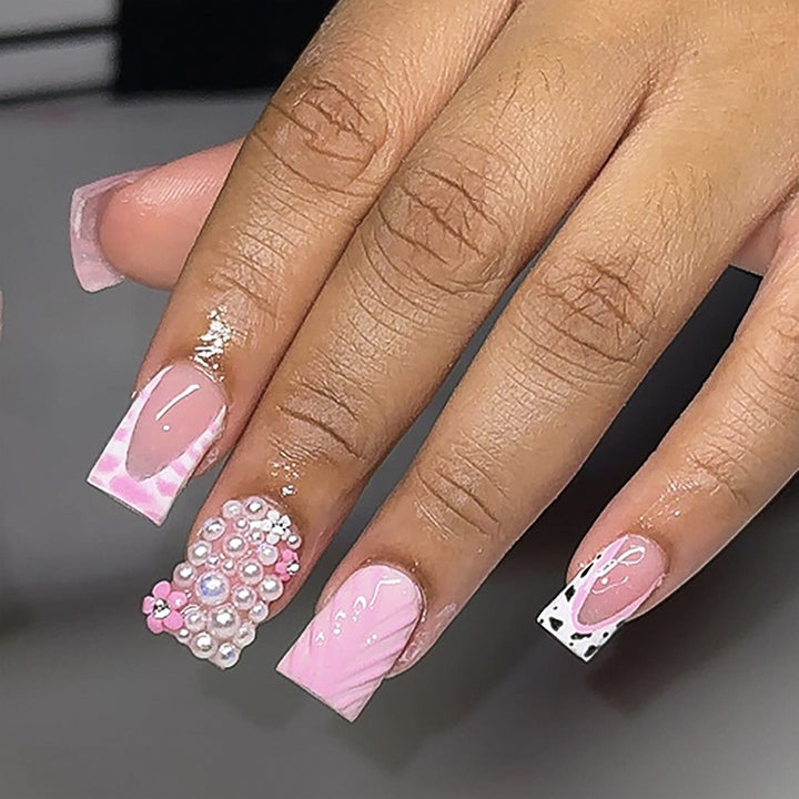 Artful nail extensions with mother-of-pearl effects and delicate design Stornfield