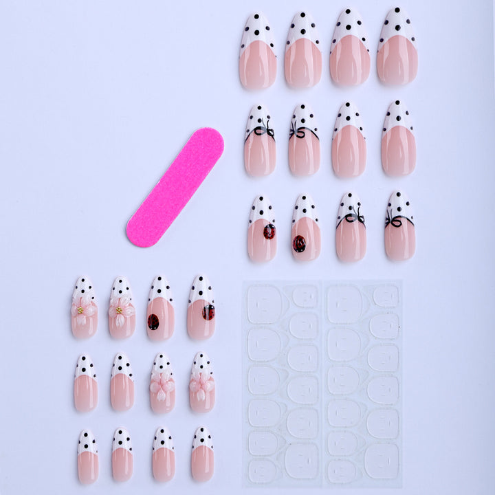 Artificial nail art with floral and playful accents Stornfield