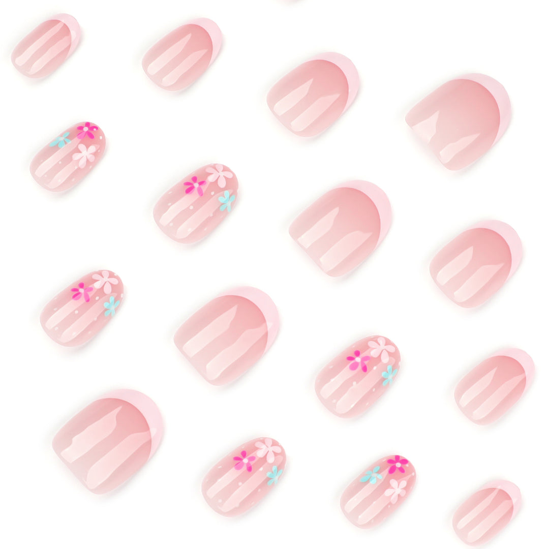 Artful nail extensions with colorful floral designs and glitter Stornfield