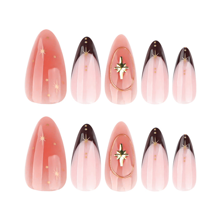 Artful stiletto nails with elegant gold embellishments Stornfield