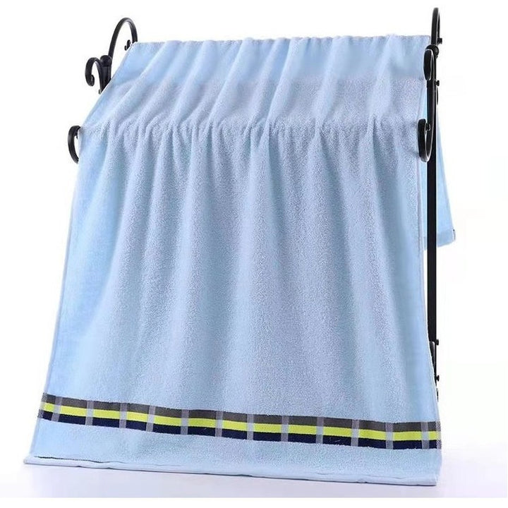 Women’s terry bath towel with elegant striped border Stornfield