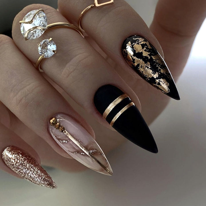 Glamorous stiletto nails with golden accents Stornfield