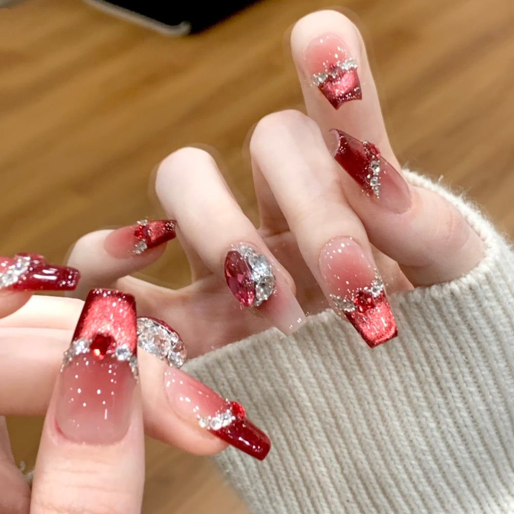 Glamorous artificial nails with sparkling rhinestone applications Stornfield