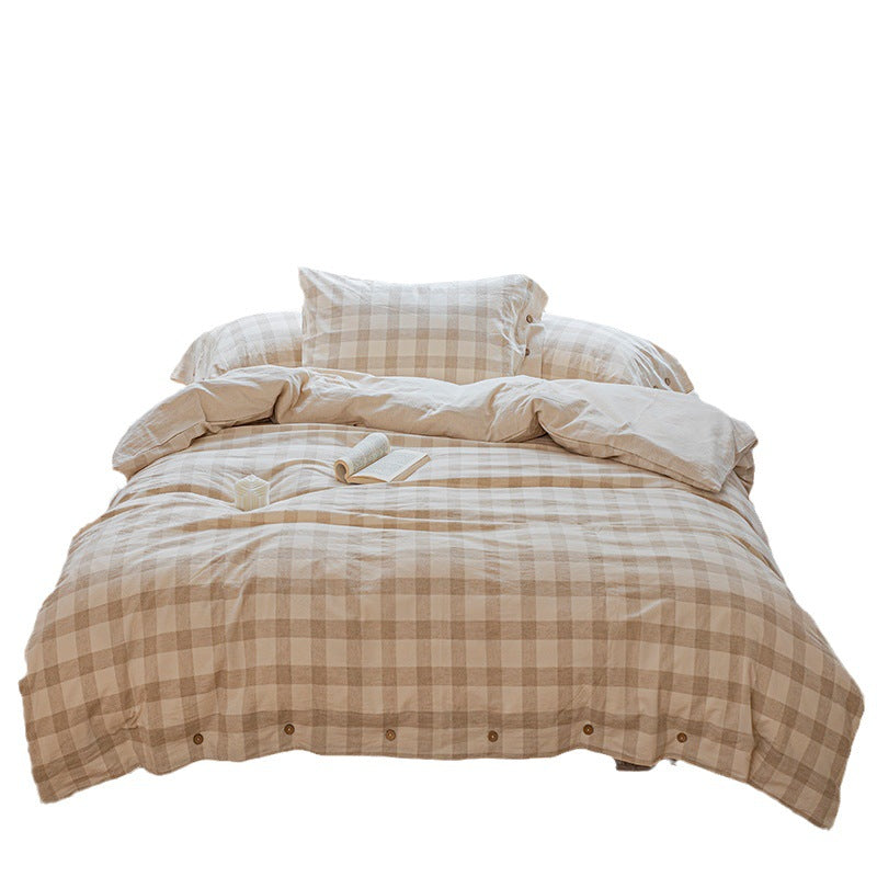 Reversible linen look duvet cover with large check pattern and wooden button closure