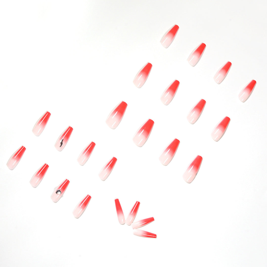 Artful stiletto nails with elegant gradient and rhinestone embellishment Stornfield