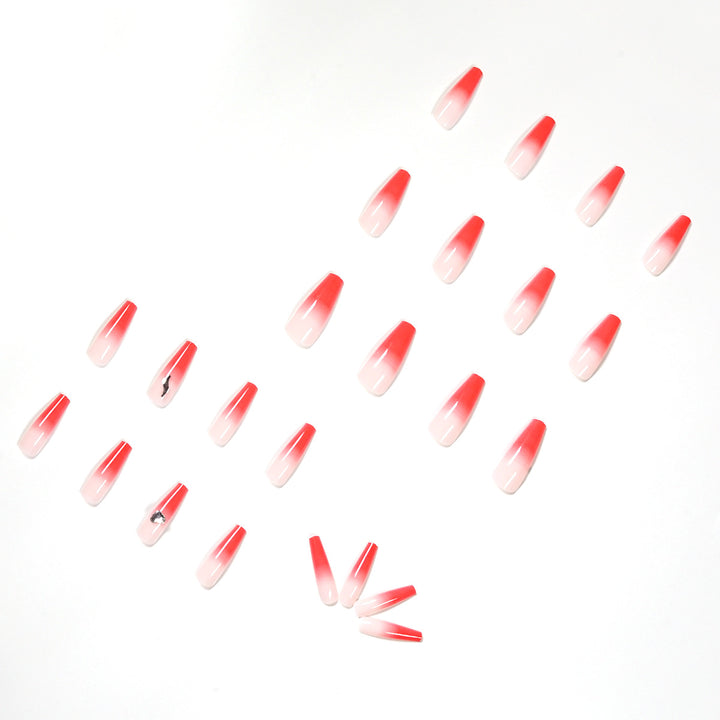 Artful stiletto nails with elegant gradient and rhinestone embellishment Stornfield