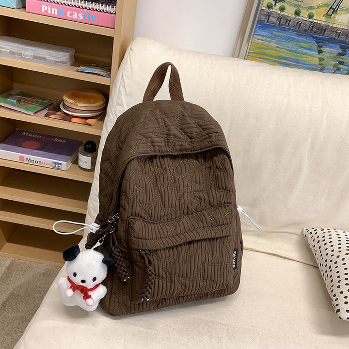 Quilted Backpack with Decorative Charm Stornfield