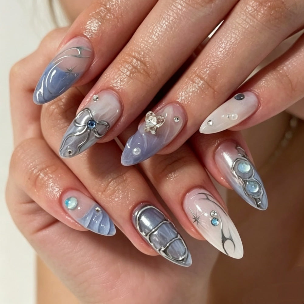 Artistic Press-On Nail Design with Floral and Gem Accents Stornfield