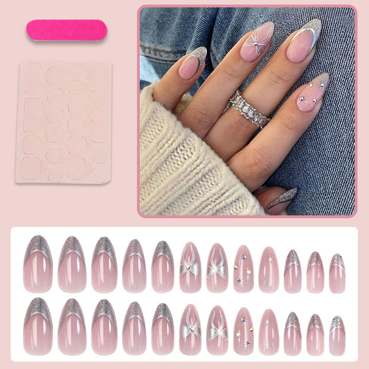 Artificial nail set with glamorous glitter and flower accents Stornfield