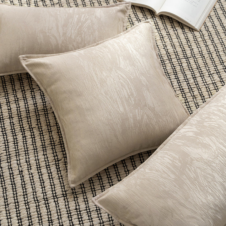 Square decorative cushion with structured Jacquard surface and piped seam