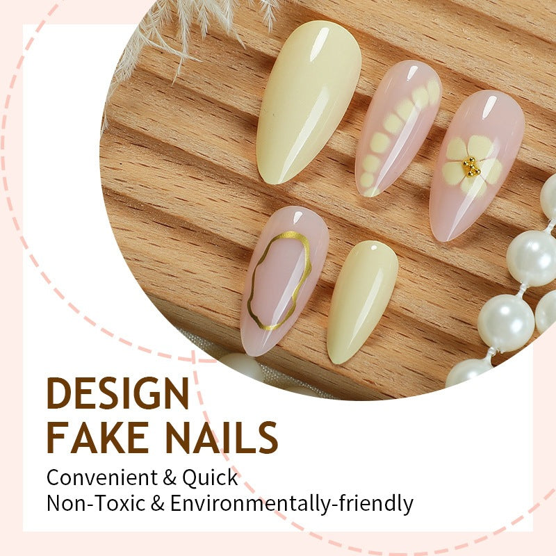 Acrylic nail set with elegant floral patterns and high-quality embellishments Stornfield