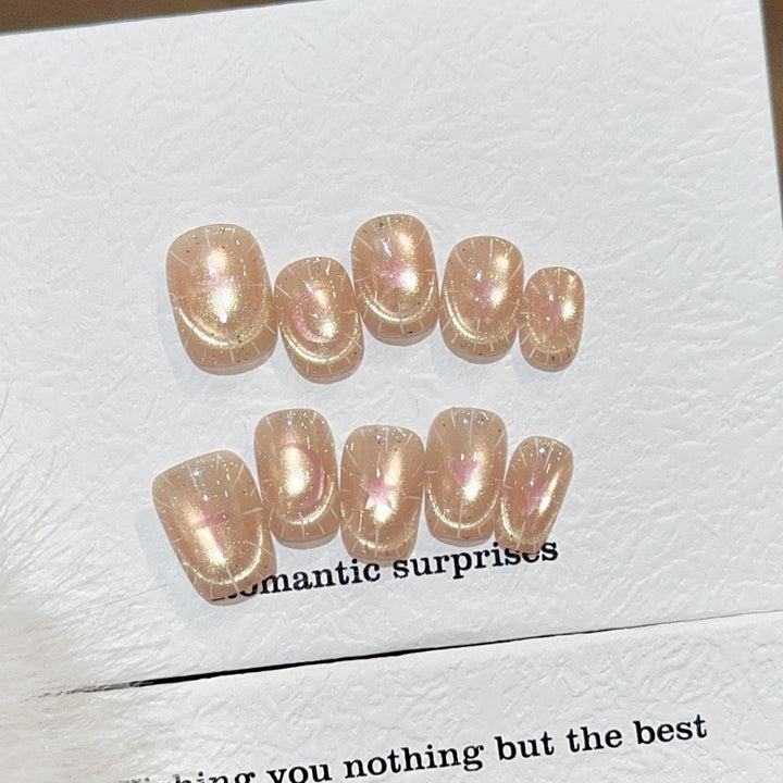 Shiny artificial nail tips with romantic shimmer Stornfield