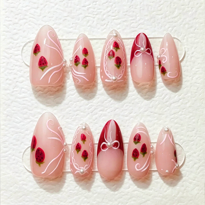Artificial nail set with romantic strawberry and bow motifs Stornfield