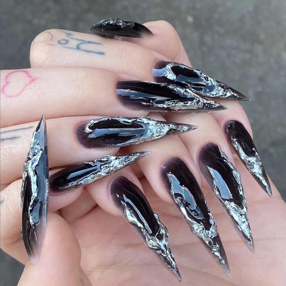 Artistic stiletto nails with modern metal effect Stornfield