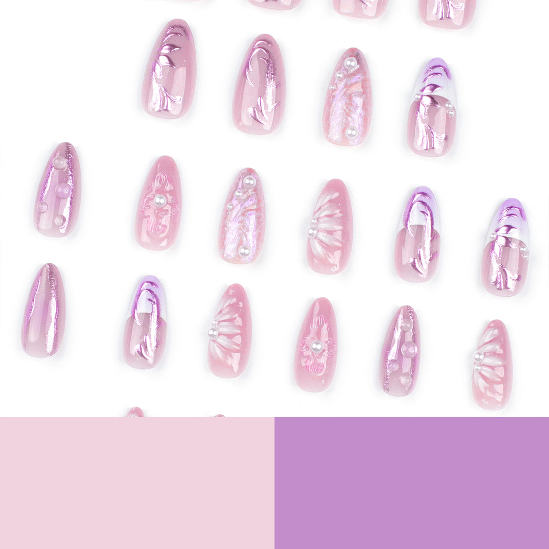 Artificial nail extensions with delicate floral designs and glitter accents Stornfield
