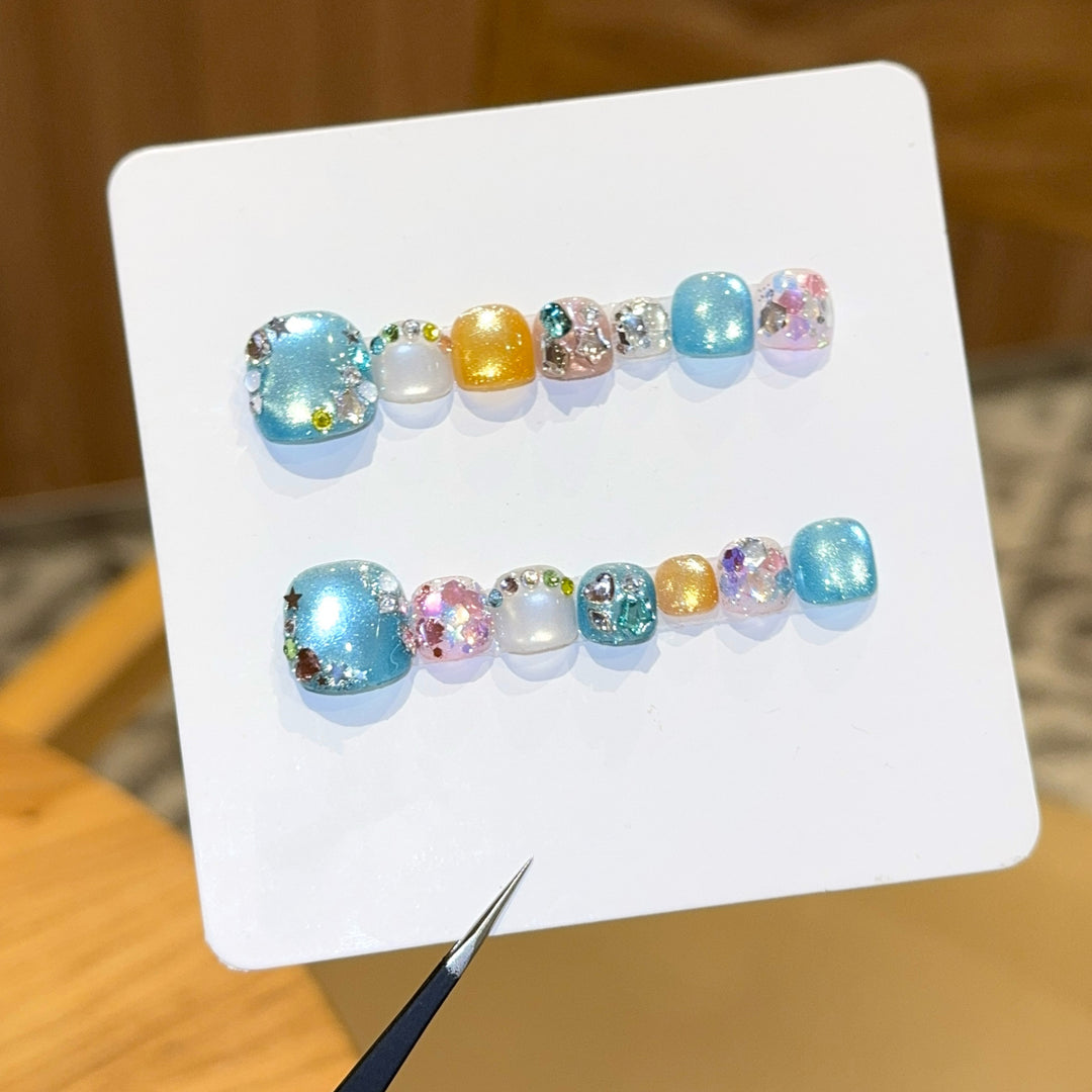 Artificial nails with sparkling accents and glittering design Stornfield