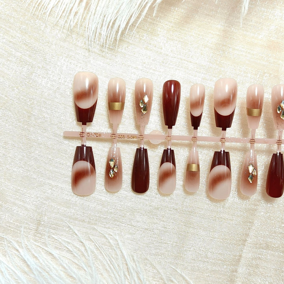 Artificial nails with elegant color gradients and jewelry details Stornfield