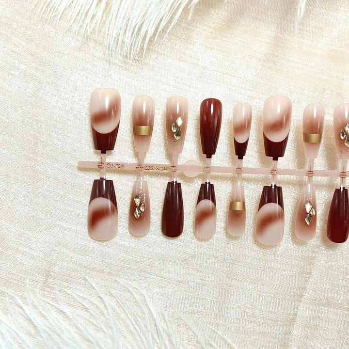 Artificial nails with elegant color gradients and jewelry details Stornfield