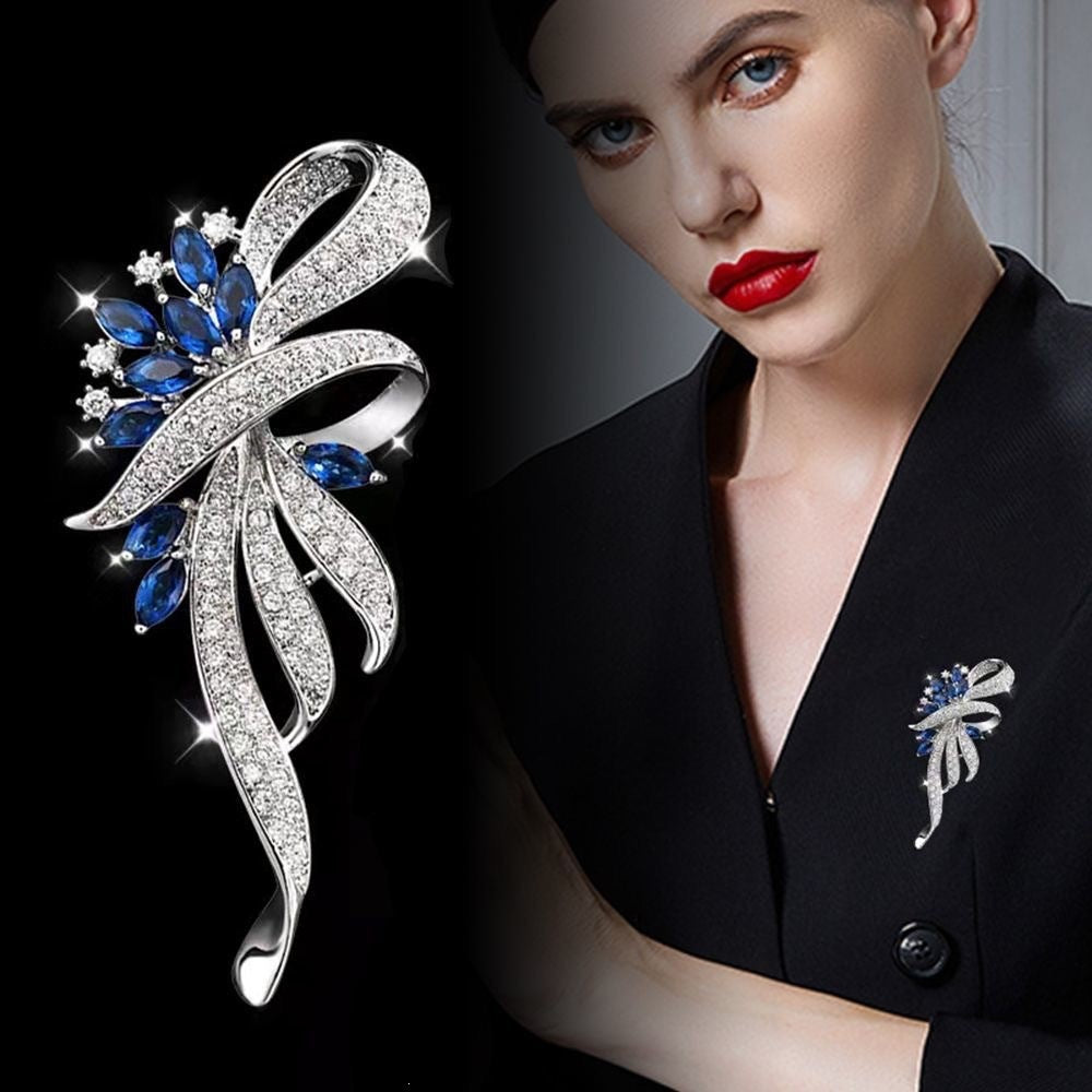 Exquisite brooch with sparkling zirconia and blue gemstones Stornfield