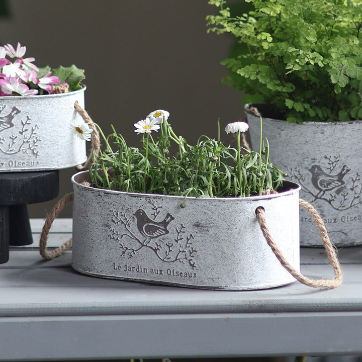Decorative storage basket made of metal with natural design Stornfield