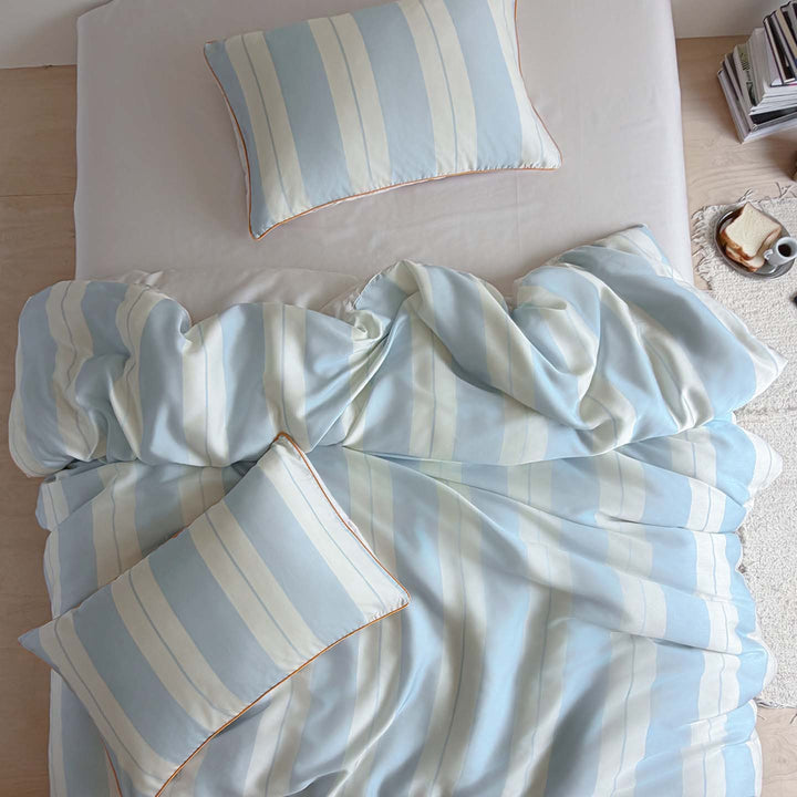 Luxurious cotton satin bedding set with fine striped pattern and piping