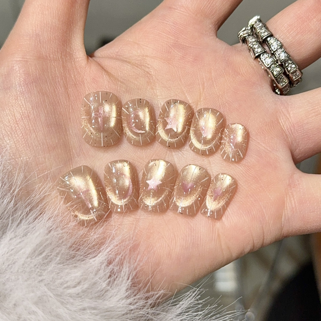 Shiny artificial nail tips with romantic shimmer Stornfield