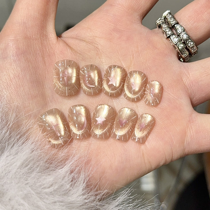 Shiny artificial nail tips with romantic shimmer Stornfield