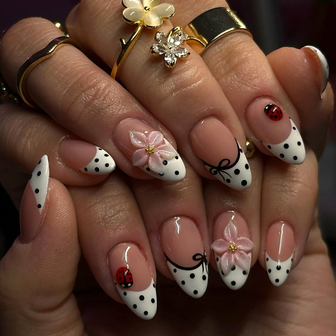 Artificial nail art with floral and playful accents Stornfield