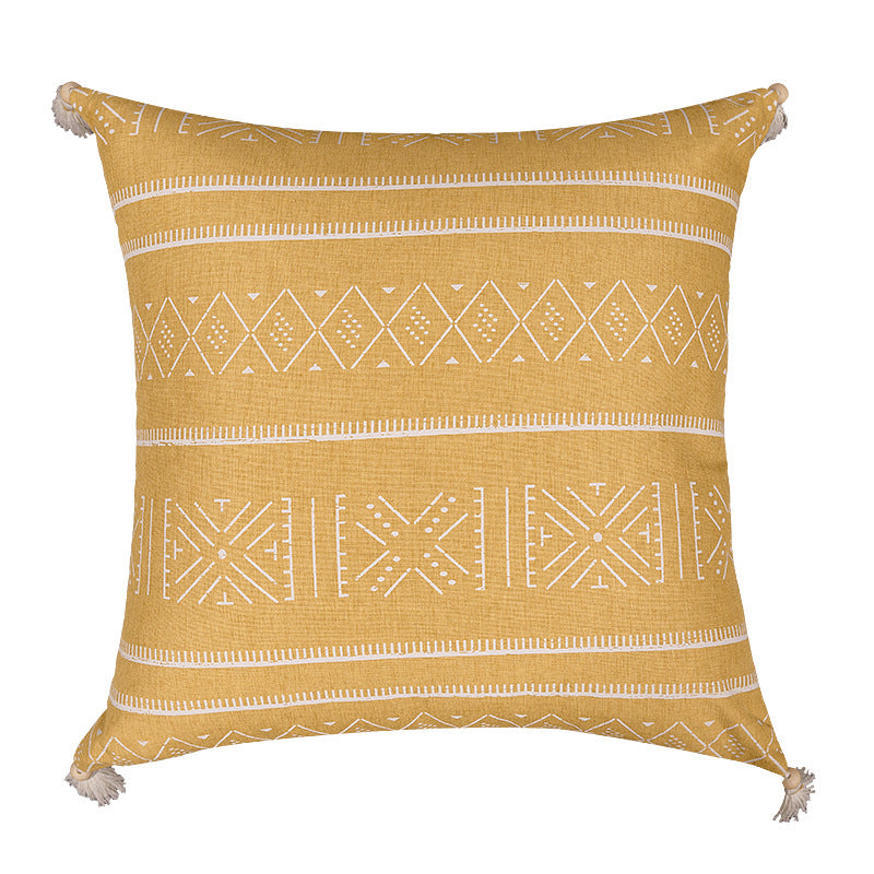Square decorative cushion cover made of cotton blend with handwoven texture, geometric diamond print, and corner tassels