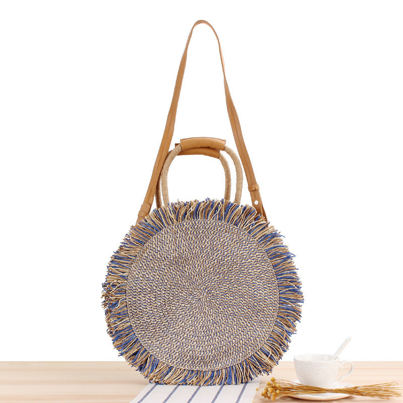 Round bag with fringe decoration Made of woven material Stornfield