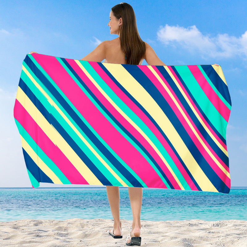 Beach towel with vibrant gradient color and stylish striped design Stornfield
