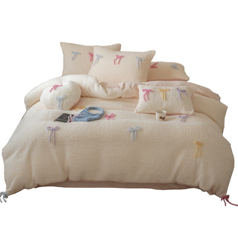 Reversible teddy fleece bedding set with 3D bow appliqués and heart decorative pillow